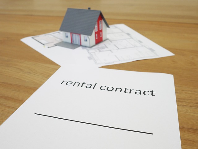 Small house model and real estate paperwork for loan affordability practice